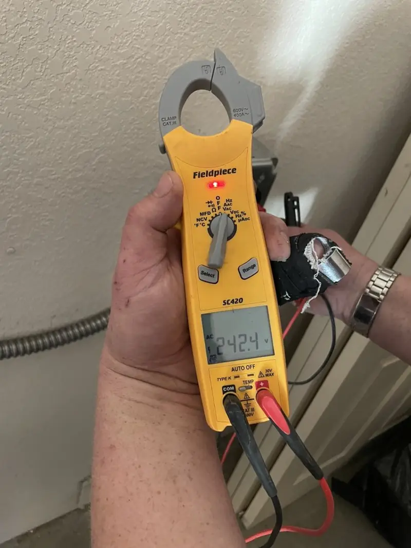 Voltage testing with clamp meter during Ceiling Fan Installation in Campbell